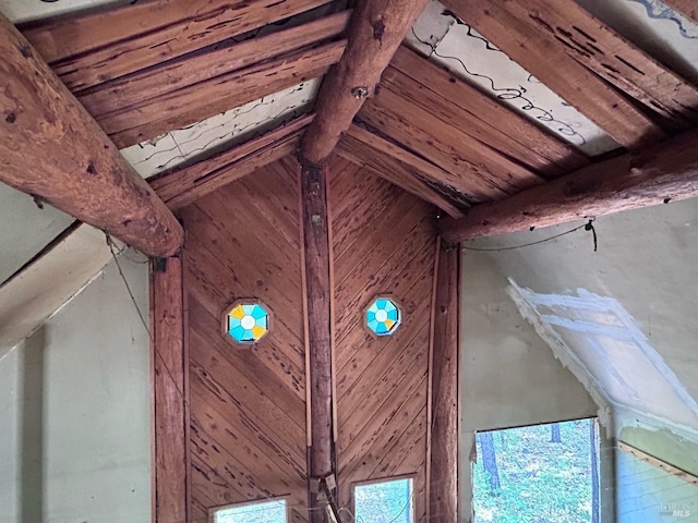 exterior details with wooden ceiling, beamed ceiling, and wood walls