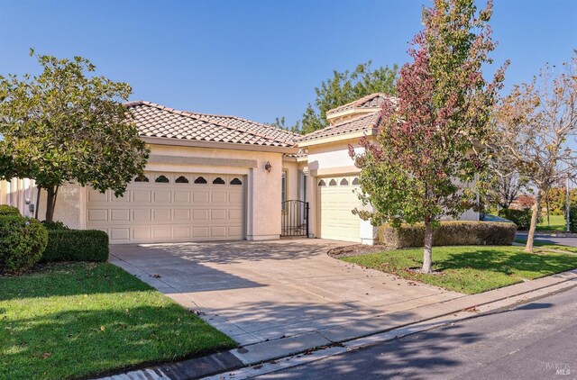 view of front facade with a front lawn and a garage