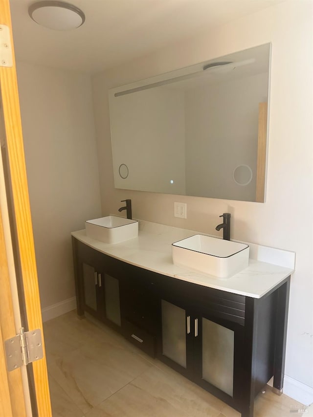 bathroom with vanity and tile patterned floors