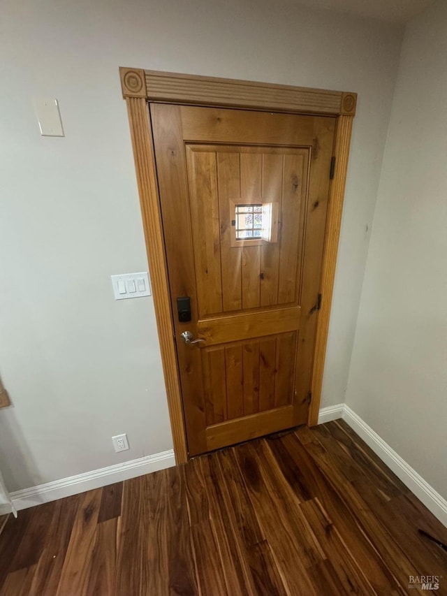 entryway with dark hardwood / wood-style floors