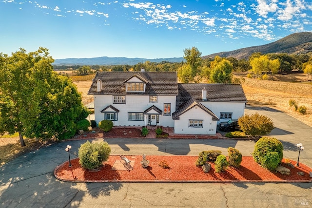 view of front of home with a mountain view