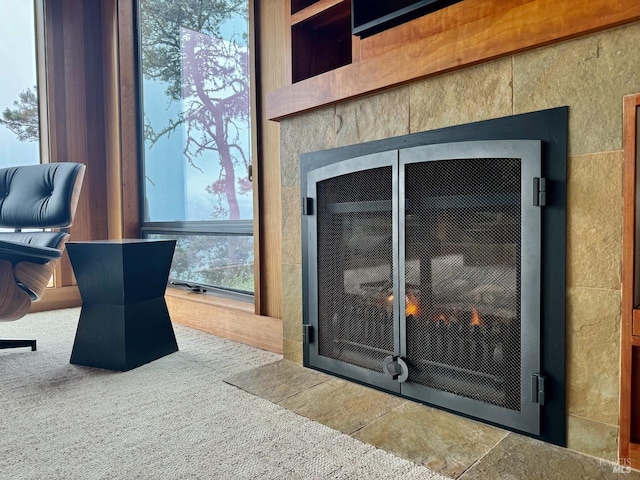 interior details featuring carpet flooring and a fireplace