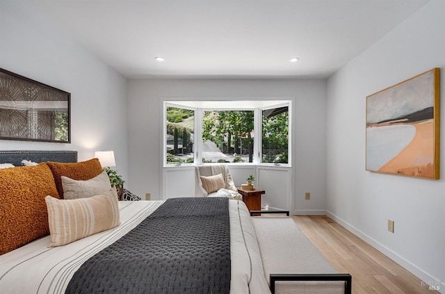 bedroom with light hardwood / wood-style flooring