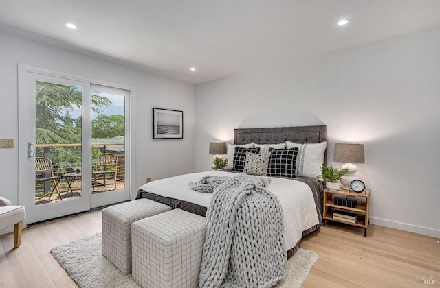 bedroom featuring light hardwood / wood-style flooring and access to outside