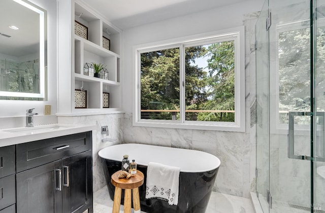 bathroom featuring independent shower and bath and vanity