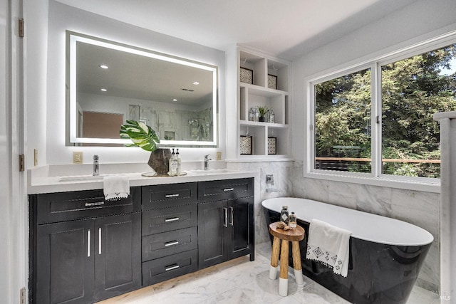 bathroom featuring separate shower and tub and vanity