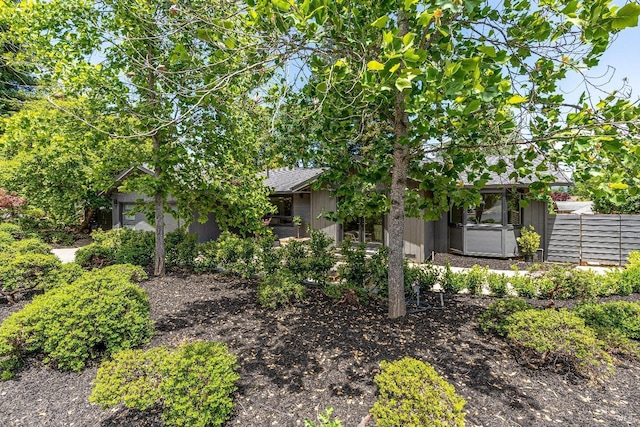 view of property hidden behind natural elements