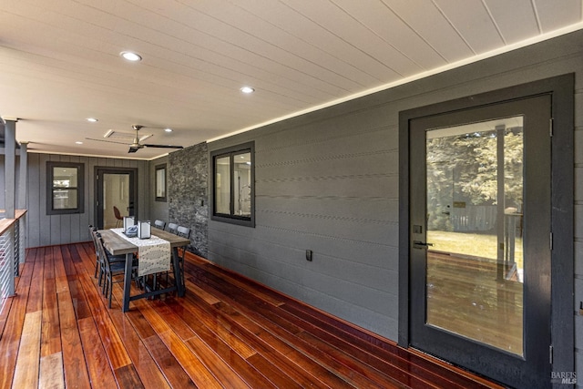 wooden deck featuring ceiling fan