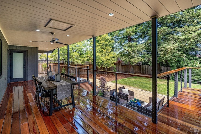 wooden deck featuring ceiling fan