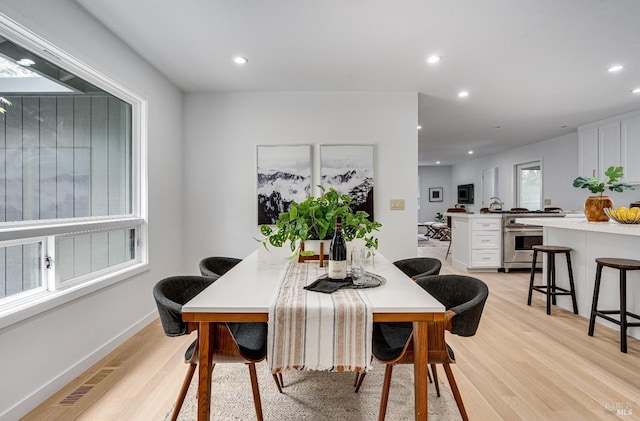 dining room featuring light hardwood / wood-style flooring