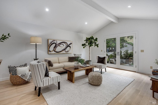 living room with lofted ceiling with beams, french doors, and light wood-type flooring