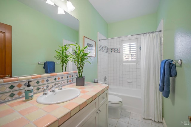 full bathroom with shower / bath combo, tasteful backsplash, vanity, tile patterned flooring, and toilet