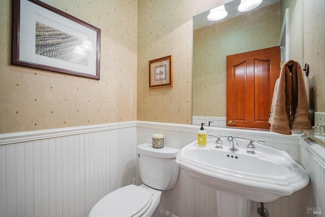 bathroom featuring sink and toilet