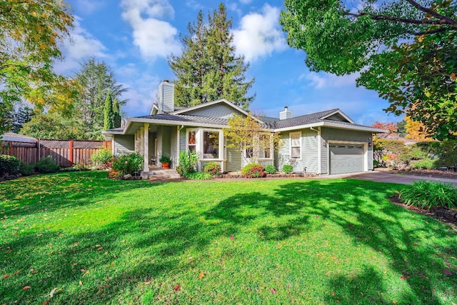 view of front of house with a garage and a front yard