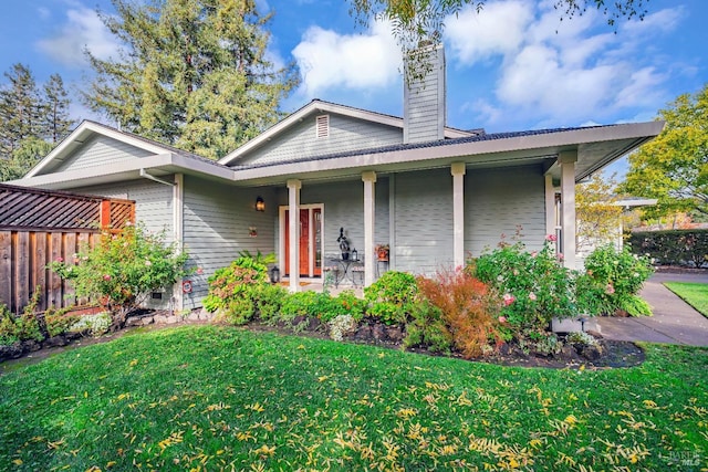 view of front of property with a front lawn and covered porch