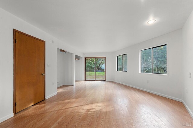 empty room with light hardwood / wood-style floors