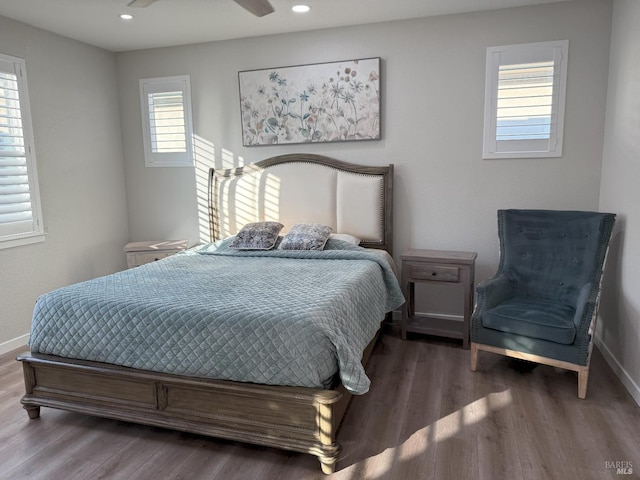 bedroom with wood-type flooring and ceiling fan