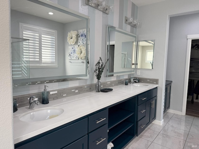 bathroom with vanity and decorative backsplash