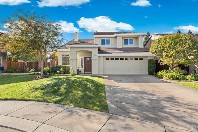 view of front of home featuring a garage and a front lawn