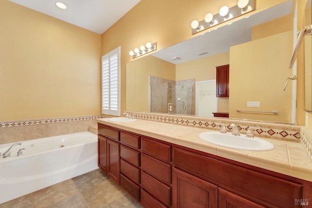 full bathroom with a garden tub, double vanity, a sink, and a shower stall