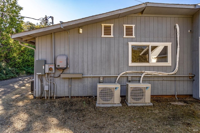 view of side of property featuring ac unit