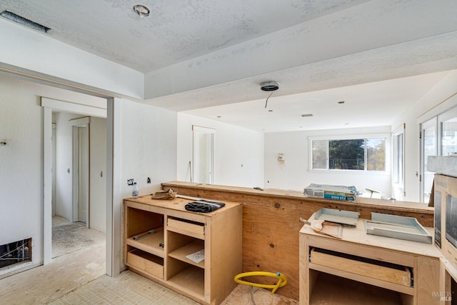 kitchen with a textured ceiling