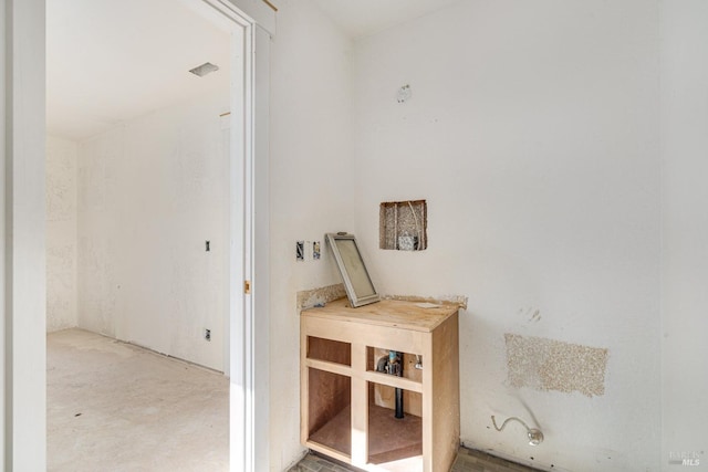 corridor with concrete flooring