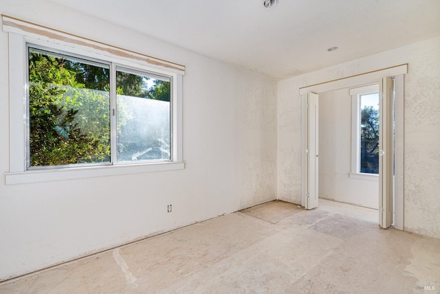 spare room featuring plenty of natural light