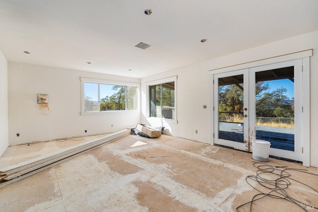 unfurnished room with french doors