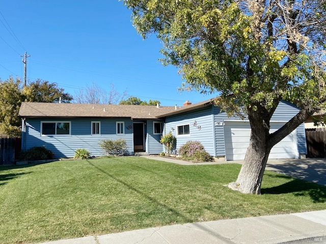 single story home featuring a garage and a front yard