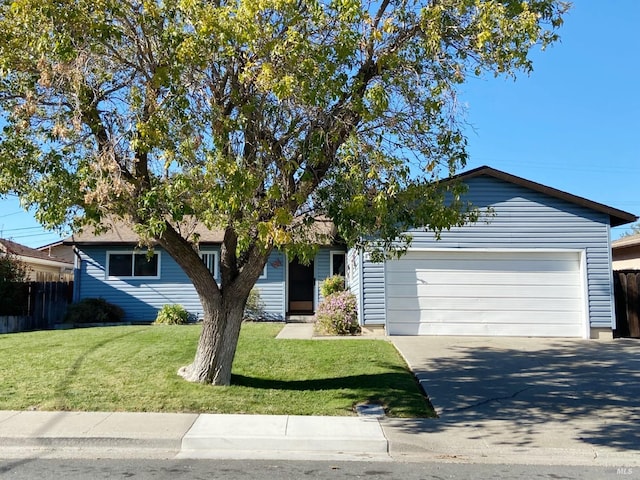 ranch-style home featuring a garage and a front lawn