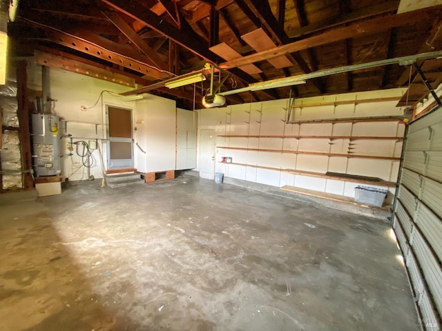 garage featuring water heater and a garage door opener