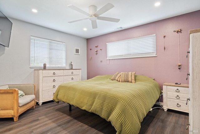 bedroom featuring ceiling fan and dark hardwood / wood-style floors