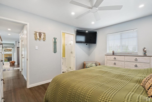 bedroom featuring ceiling fan, dark hardwood / wood-style floors, and connected bathroom