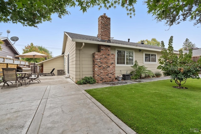 back of house with a patio area, a yard, and cooling unit