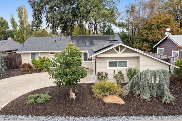 view of front of home featuring solar panels