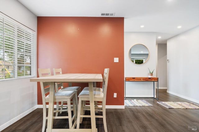 dining space featuring dark hardwood / wood-style flooring