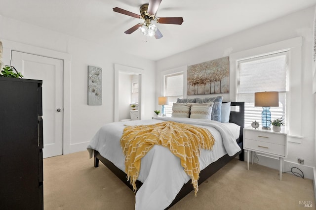 bedroom featuring ceiling fan and light carpet