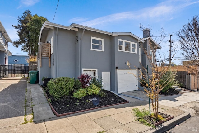 view of property exterior with a garage