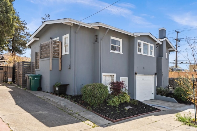 view of side of property featuring a garage