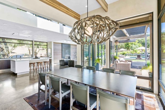 2610 Atlas Peak Rd Unit 2, Napa, CA 94558 - dining space with concrete flooring, a wealth of natural light, beam ceiling, and an inviting chandelier