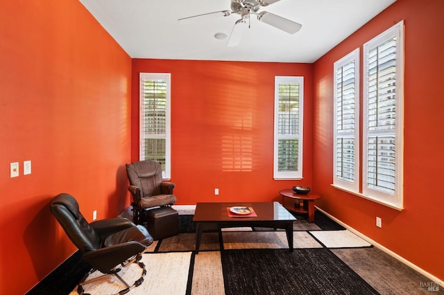 sitting room featuring carpet floors and ceiling fan