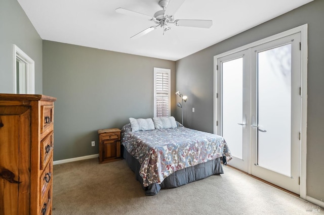 carpeted bedroom featuring french doors and ceiling fan