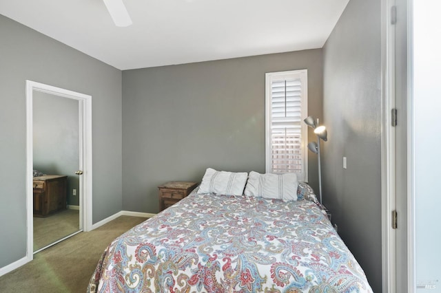 bedroom with a closet, ceiling fan, and carpet floors