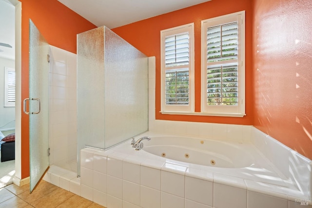 bathroom with tile patterned flooring and separate shower and tub