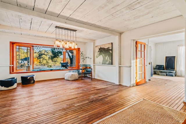 interior space featuring wood-type flooring, beam ceiling, and wooden ceiling