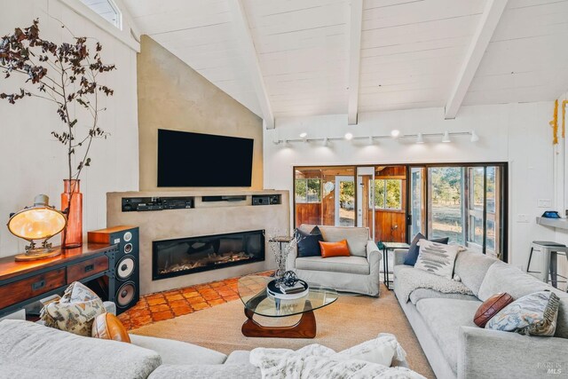 living room with lofted ceiling with beams, track lighting, and wooden ceiling