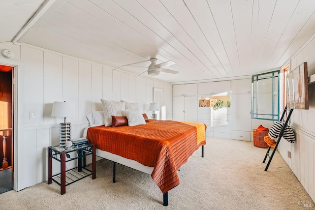 bedroom featuring ceiling fan and light carpet