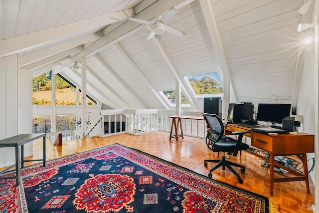 office space featuring ceiling fan, vaulted ceiling with beams, and parquet floors