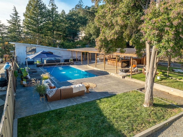 view of swimming pool with a lawn, an outdoor hangout area, and a patio area